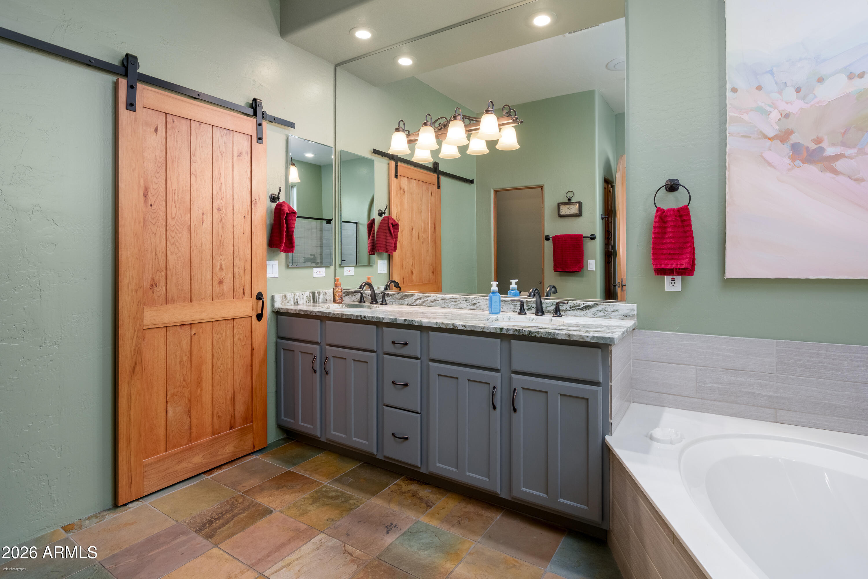 100 Rio Sinagua Sedona, AZ 86351 - Photo 23 of 43 a bathroom with a bathtub sink and mirror