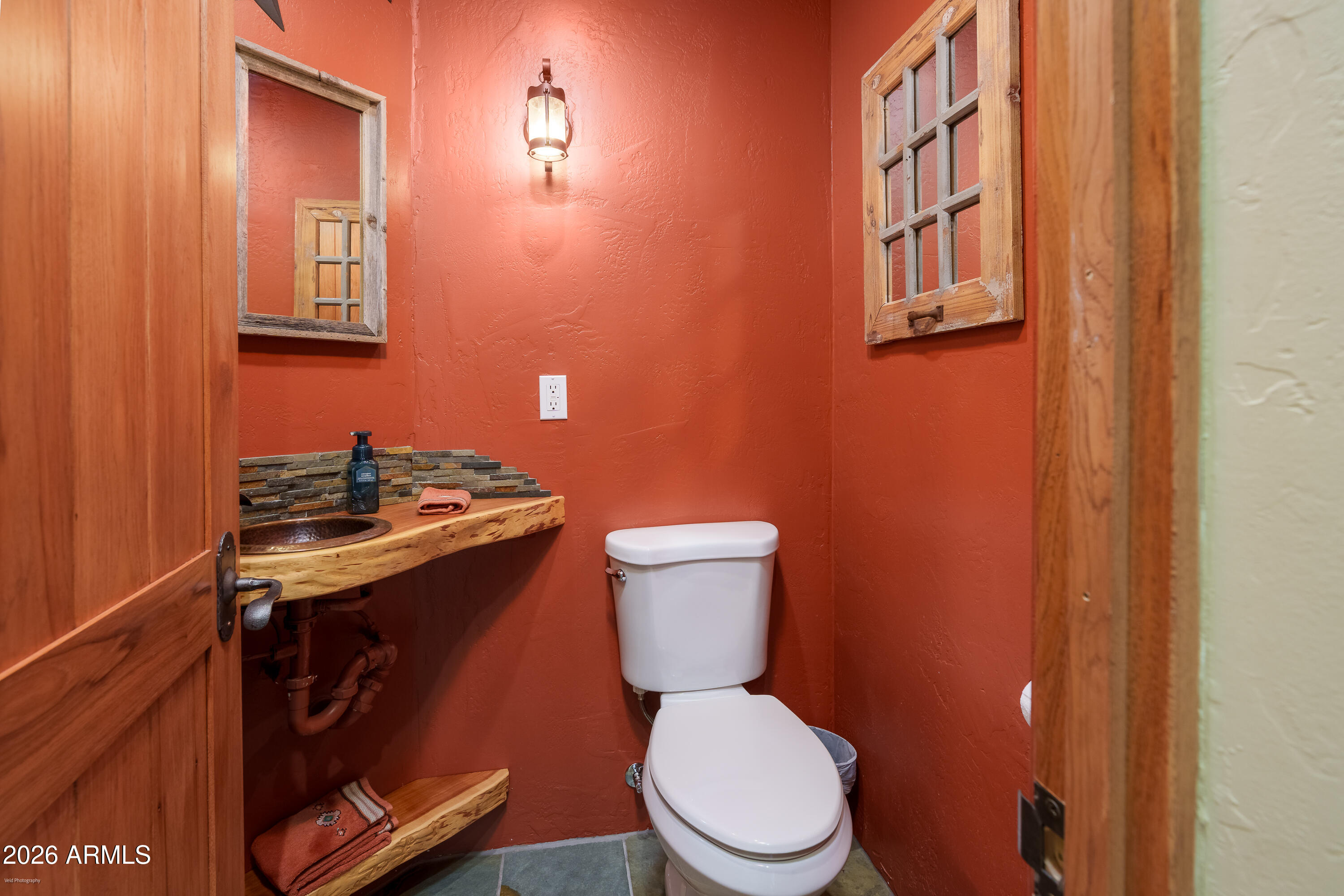 100 Rio Sinagua Sedona, AZ 86351 - Photo 31 of 43 a bathroom with a granite countertop toilet and a sink