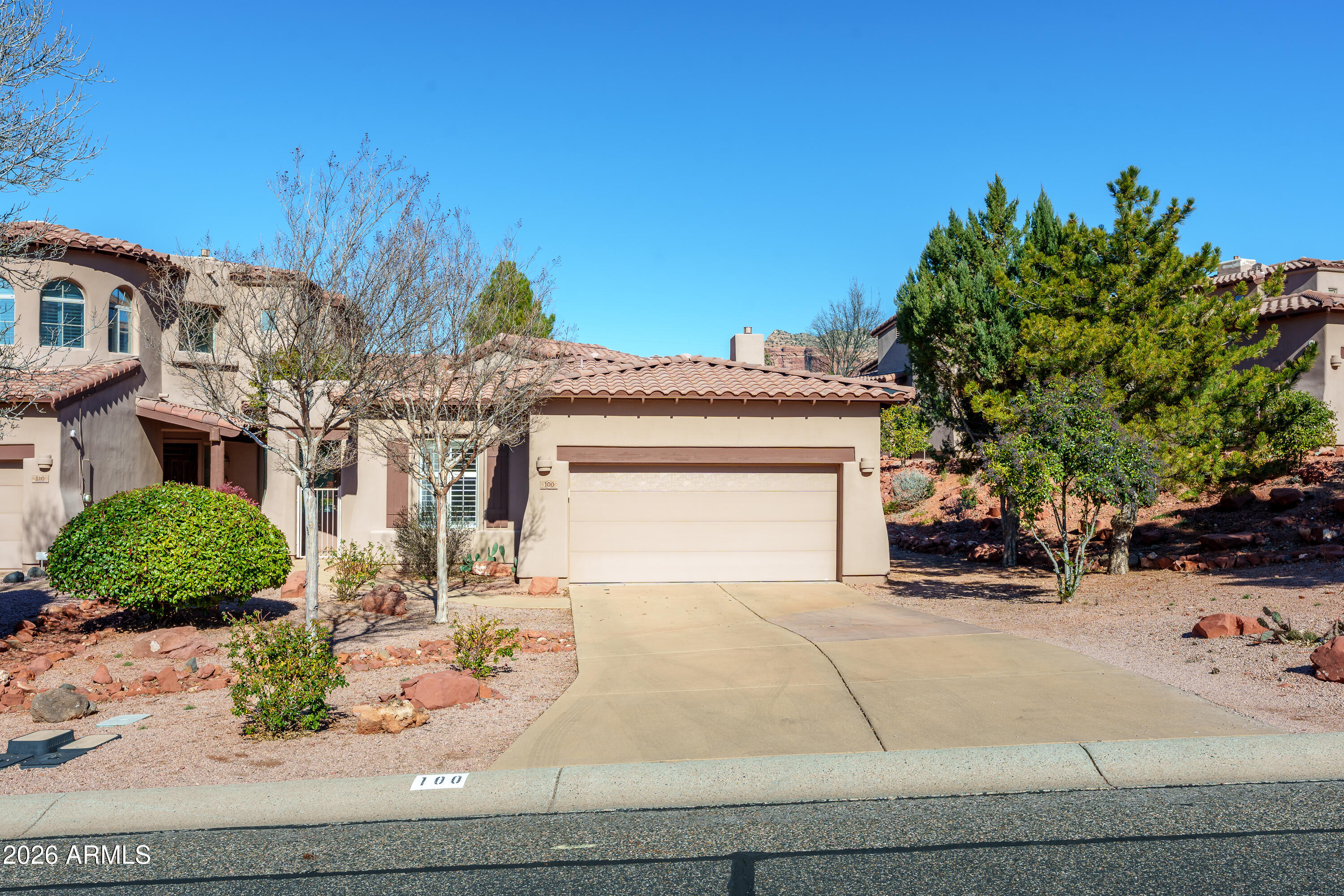 100 Rio Sinagua Sedona, AZ 86351 - Photo 4 of 43 a front view of a house with garden