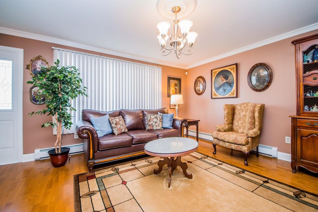 1461 Rodman Street Fall River, MA 02721 - Photo 13 of 40 a living room with furniture and a large window
