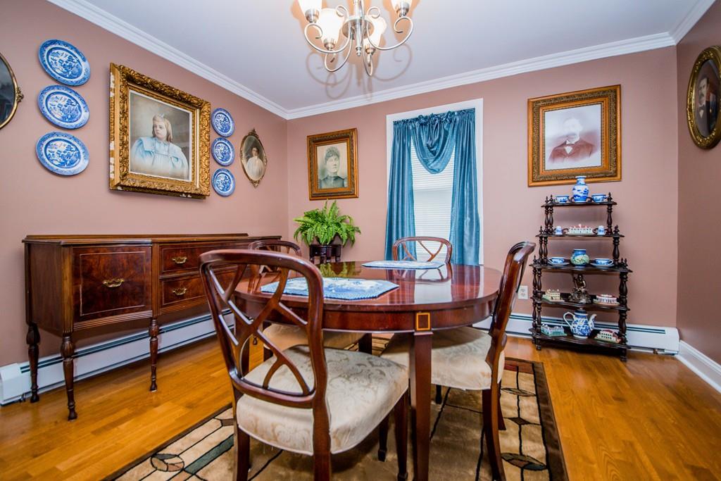 1461 Rodman Street Fall River, MA 02721 - Photo 17 of 40 a view of a dining room with furniture and chandelier