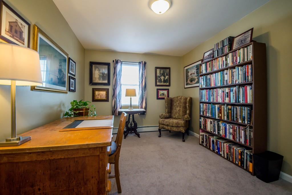 1461 Rodman Street Fall River, MA 02721 - Photo 30 of 40 a living room with bookshelf and a window