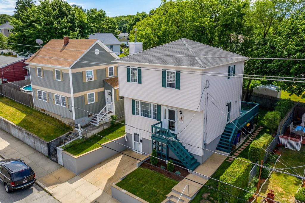 1461 Rodman Street Fall River, MA 02721 - Photo 3 of 40 an aerial view of a house with a yard