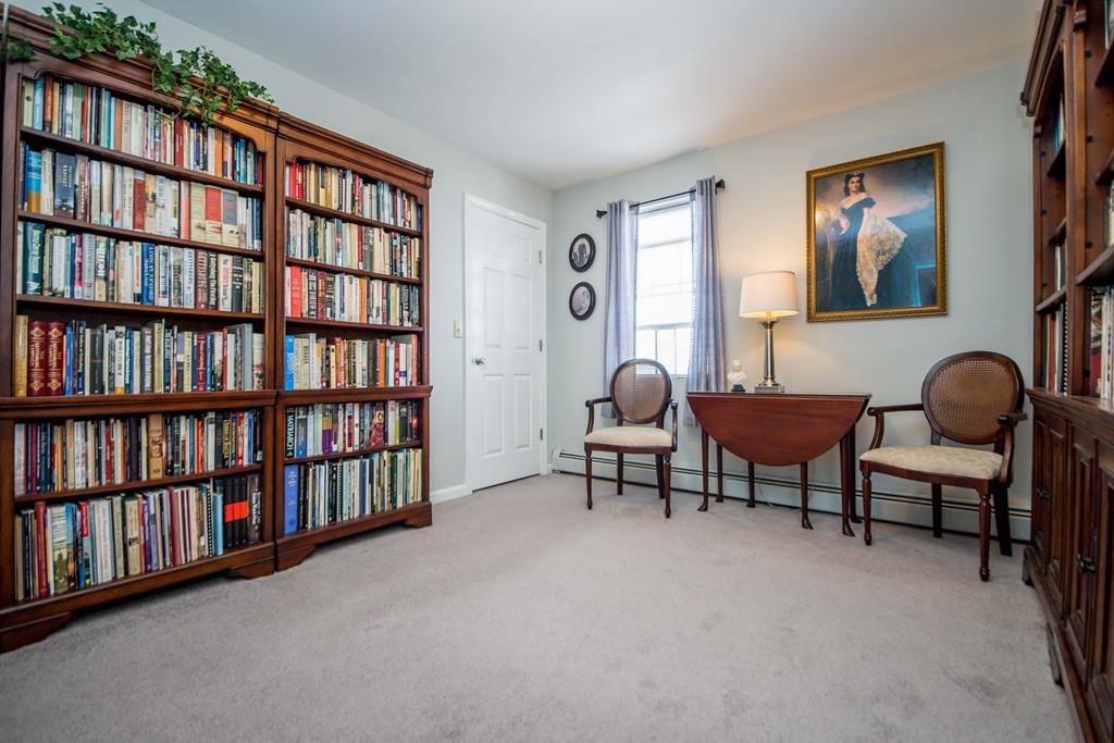 1461 Rodman Street Fall River, MA 02721 - Photo 33 of 40 a living room with furniture and a book shelf