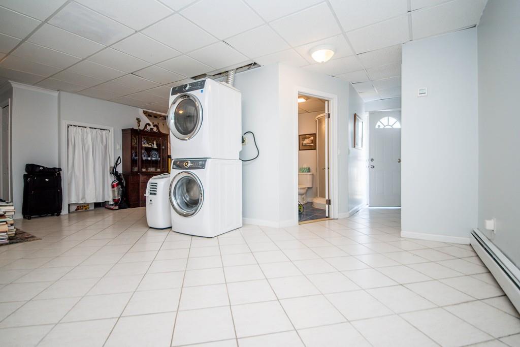 1461 Rodman Street Fall River, MA 02721 - Photo 36 of 40 a view of a storage & utility room with washer and dryer