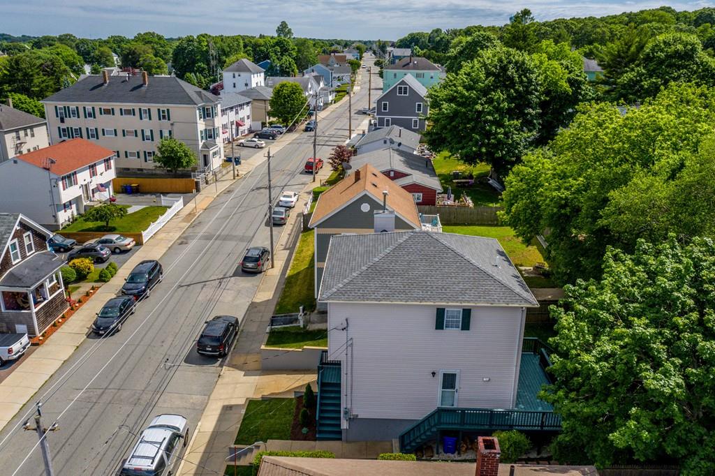 1461 Rodman Street Fall River, MA 02721 - Photo 6 of 40 an aerial view of multiple houses with yard