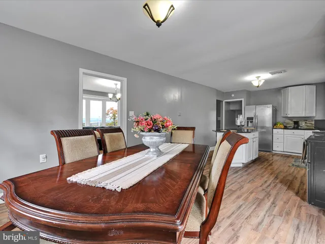 a bed room with furniture and a chair