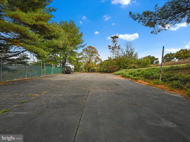 a view of a road with a building in the background