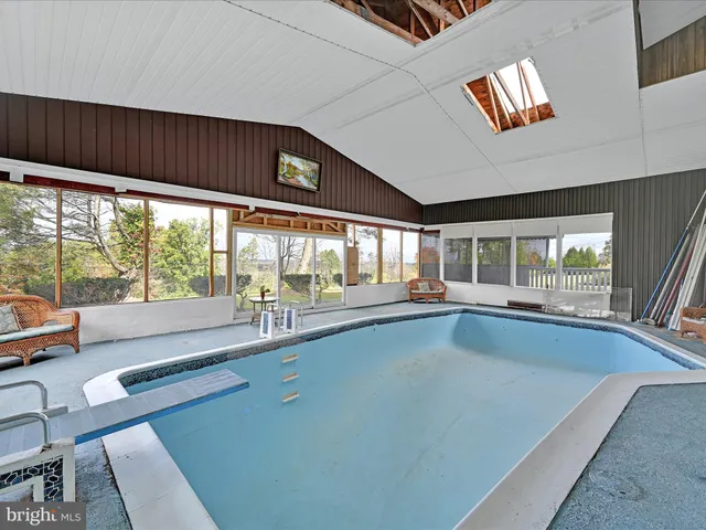 a large window with swimming pool in front of it