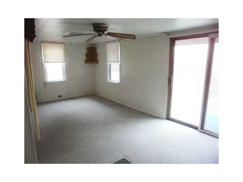 198 Mahle Road Clarksville, PA 15322 - Photo 8 of 22 Living Room. Another view of the Living Room with corner hanging shelf ( those are the door bell chimes you see to the left in the photo )