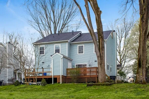 a front view of a house with a garden