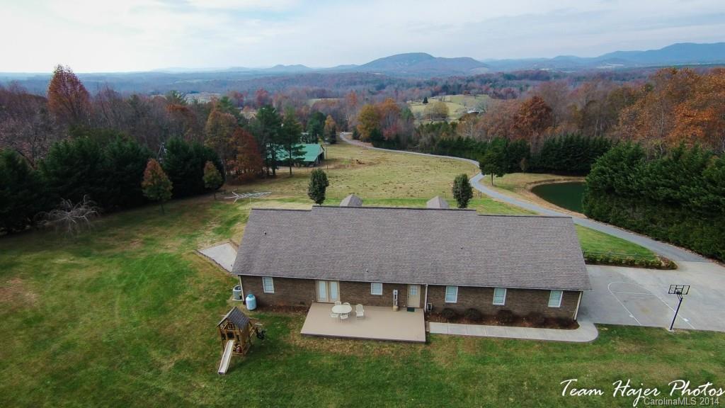 7858 Cheatham Ford Road Hiddenite, NC 28636 - Photo 2 of 24 an aerial view of a house with a yard