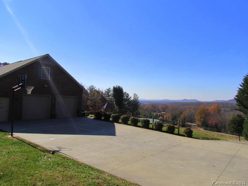 7858 Cheatham Ford Road Hiddenite, NC 28636 - Photo 6 of 24 a front view of a house with a yard