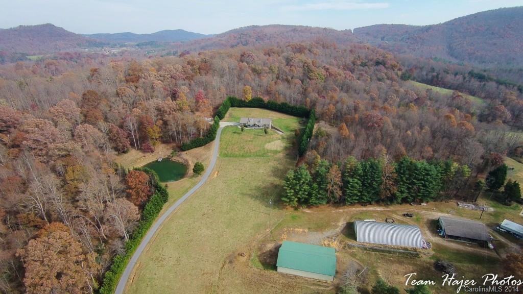 7858 Cheatham Ford Road Hiddenite, NC 28636 - Photo 7 of 24 a view of a house with a yard