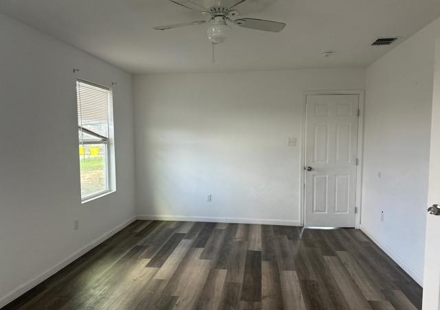 2519 County Road 5710 Devine, TX 78016 - Photo 13 of 18 wooden floor in an empty room with a window