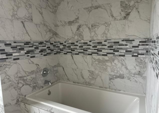 2519 County Road 5710 Devine, TX 78016 - Photo 16 of 18 a bathroom with a bathtub