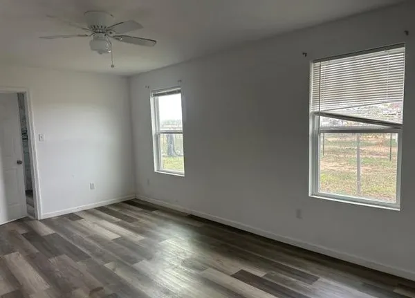 a view of an empty room with a window