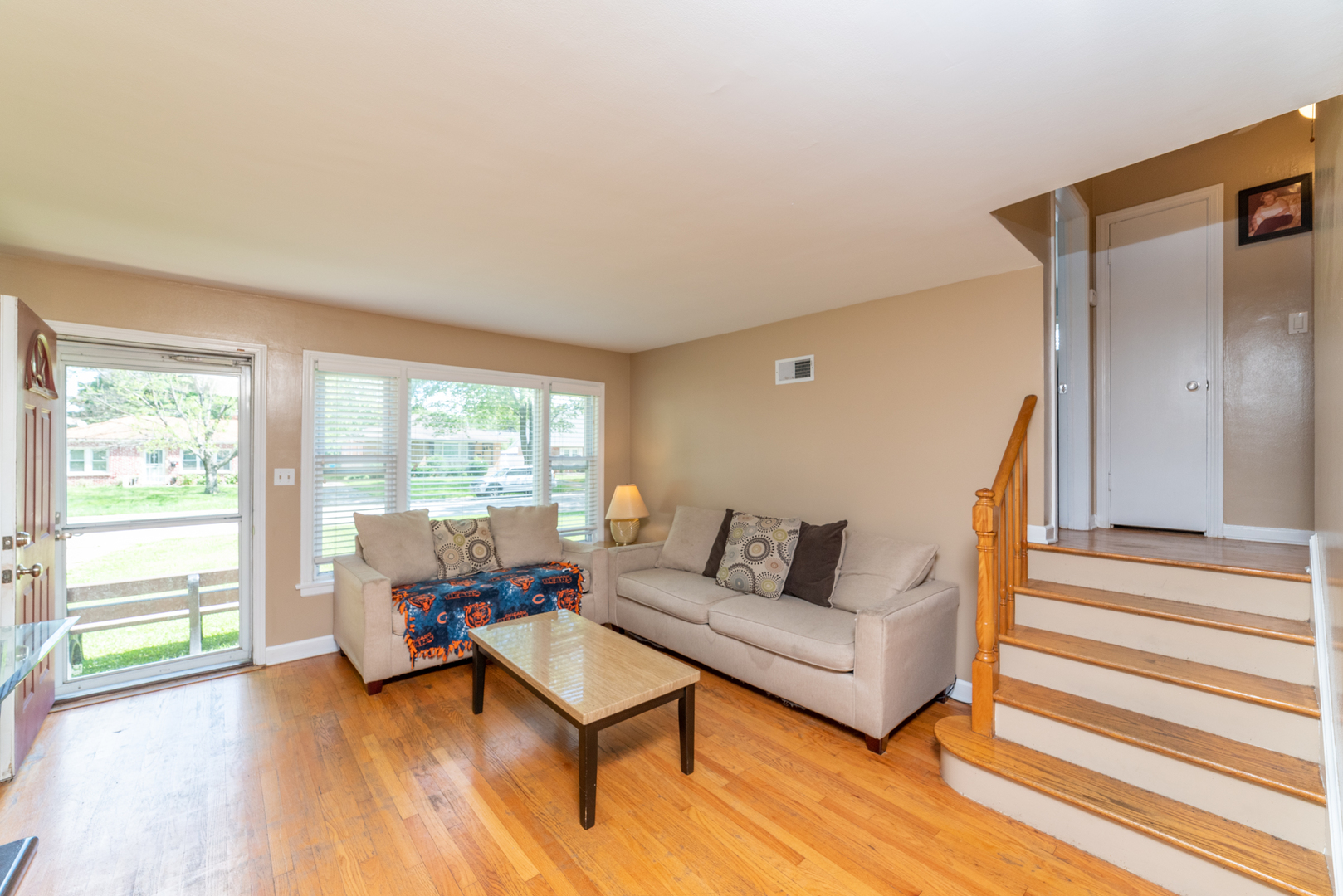 1528 Morris Avenue Berkeley, IL 60163 - Photo 4 of 25 a living room with furniture and a wooden floor