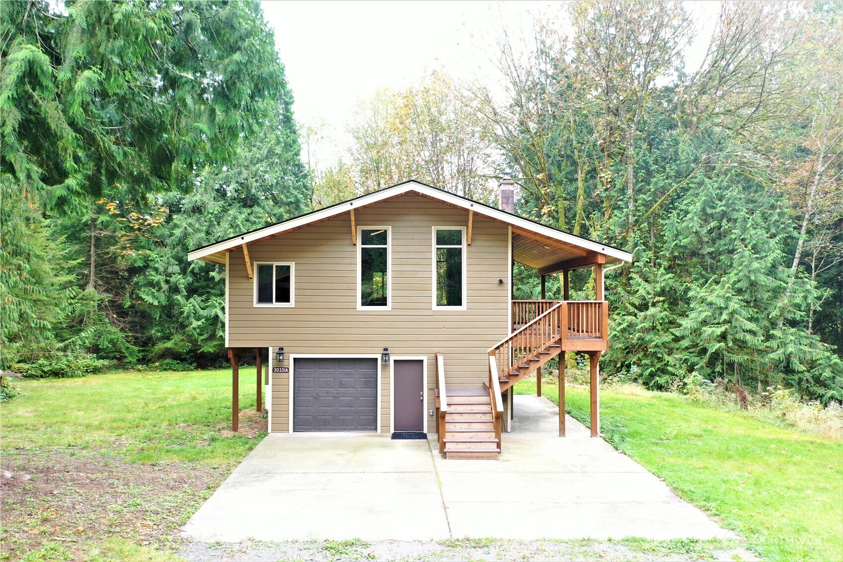 30331 Heimer Road Arlington, WA 98223 - Photo 32 of 37 a front view of a house with a yard and porch