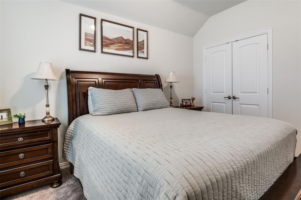 14845 Gilley Lane Fort Worth, TX 76052 - Photo 13 of 35 a bedroom with a bed and a night stand