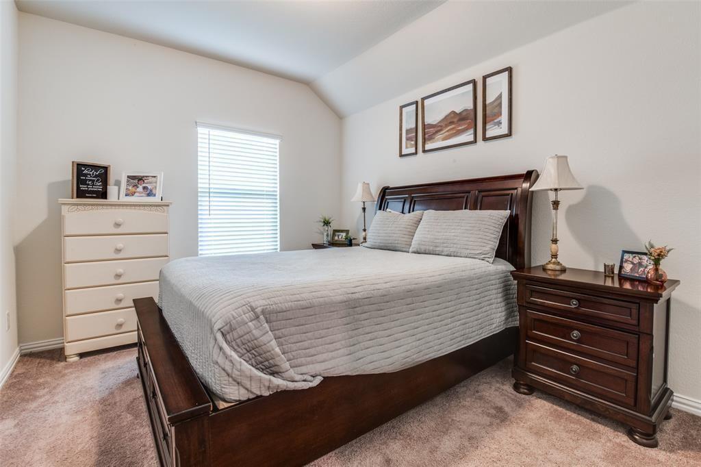 14845 Gilley Lane Fort Worth, TX 76052 - Photo 14 of 35 a bedroom with a bed and a dresser