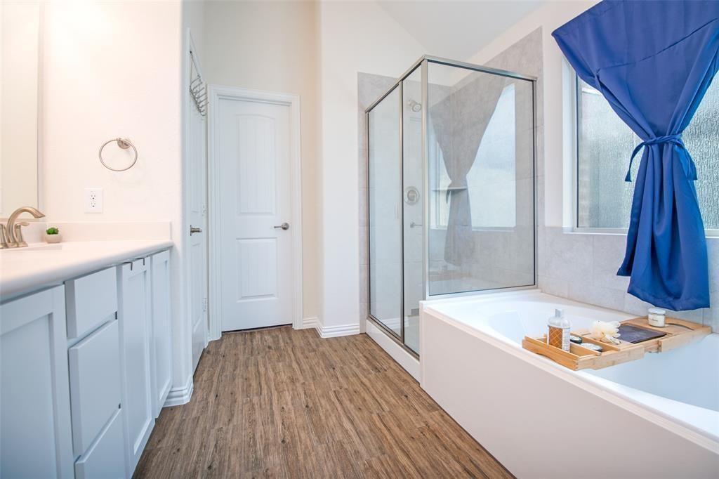 14845 Gilley Lane Fort Worth, TX 76052 - Photo 15 of 35 a bathroom with a bathtub and a sink