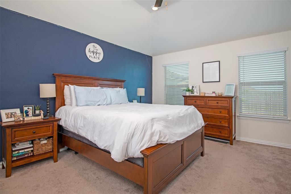 14845 Gilley Lane Fort Worth, TX 76052 - Photo 17 of 35 a bed sitting in a bedroom and dresser