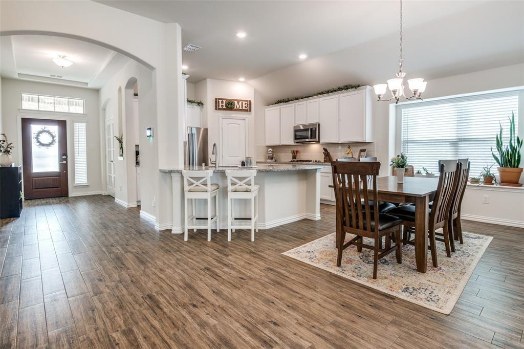 14845 Gilley Lane Fort Worth, TX 76052 - Photo 24 of 35 a view of a dining room with furniture and wooden floor