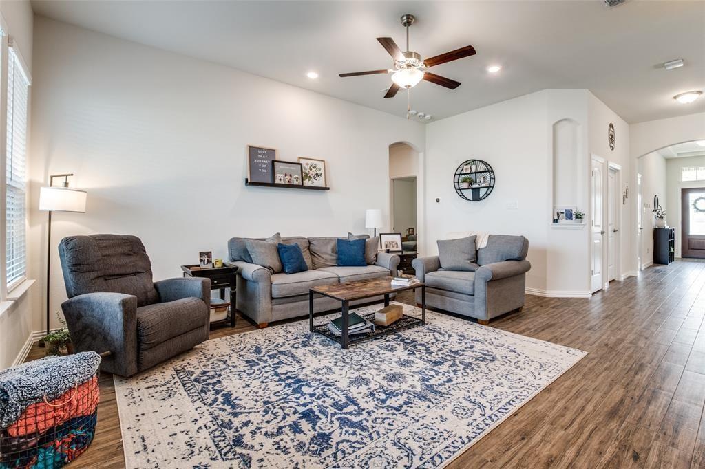 14845 Gilley Lane Fort Worth, TX 76052 - Photo 29 of 35 a living room with furniture ceiling fan and a rug