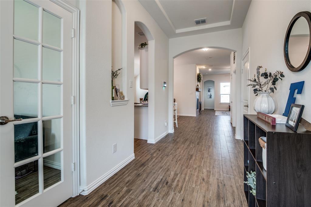 14845 Gilley Lane Fort Worth, TX 76052 - Photo 31 of 35 a view of a hallway with wooden floor and staircase