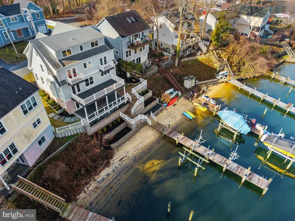 an aerial view of a house with a swimming pool
