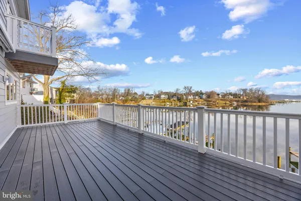 a view of a balcony with wooden floor