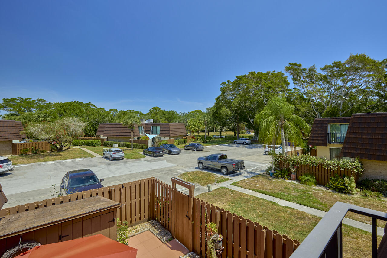 6025 Southeast Riverboat Drive, Unit 811 Stuart, FL 34997 - Photo 32 of 37 a view of a backyard with sitting area
