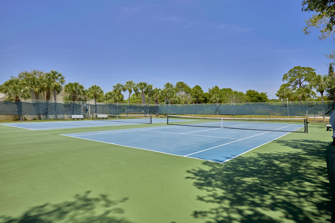 6025 Southeast Riverboat Drive, Unit 811 Stuart, FL 34997 - Photo 35 of 37 a view of a golf course with a lake
