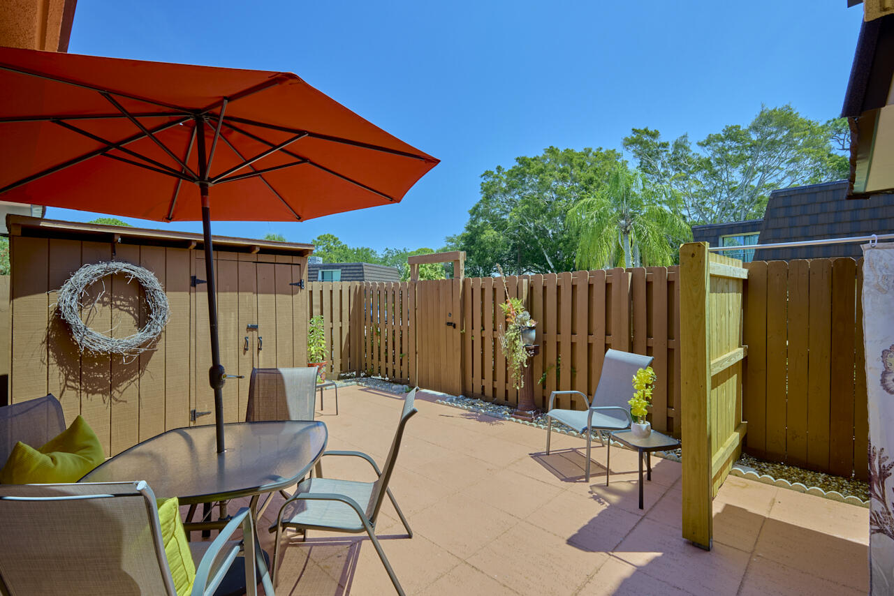6025 Southeast Riverboat Drive, Unit 811 Stuart, FL 34997 - Photo 4 of 37 a view of outdoor space with seating