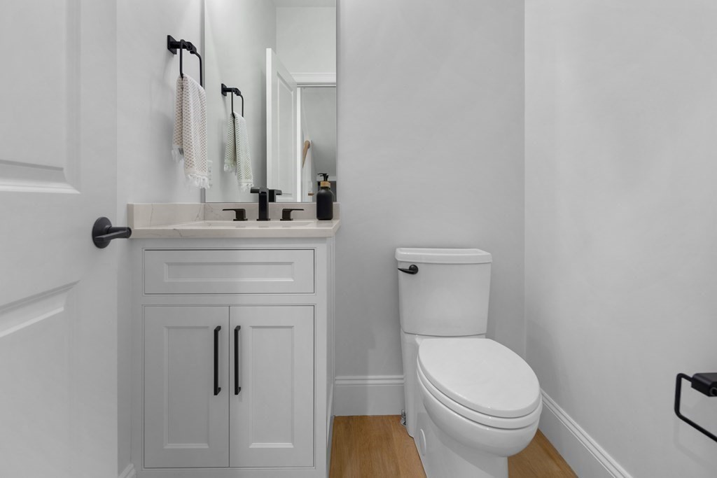 6 Rowell Road Middleton, MA 01949 - Photo 19 of 35 a bathroom with a toilet sink and mirror