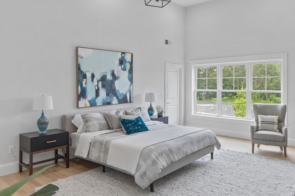 6 Rowell Road Middleton, MA 01949 - Photo 23 of 35 a bedroom with a bed and a painting on the wall