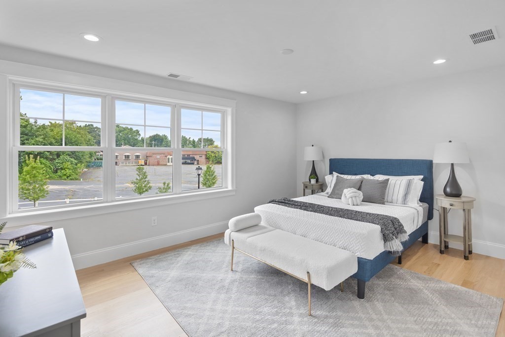 6 Rowell Road Middleton, MA 01949 - Photo 30 of 35 a spacious bedroom with a bed and a large window