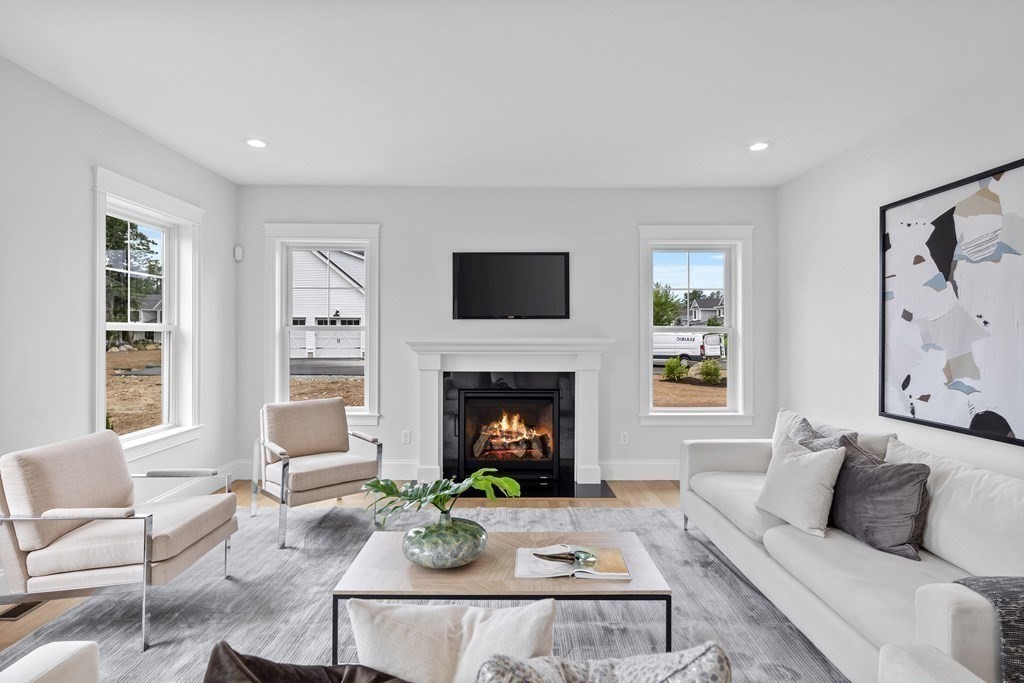 6 Rowell Road Middleton, MA 01949 - Photo 3 of 35 a living room with furniture a window and a fireplace