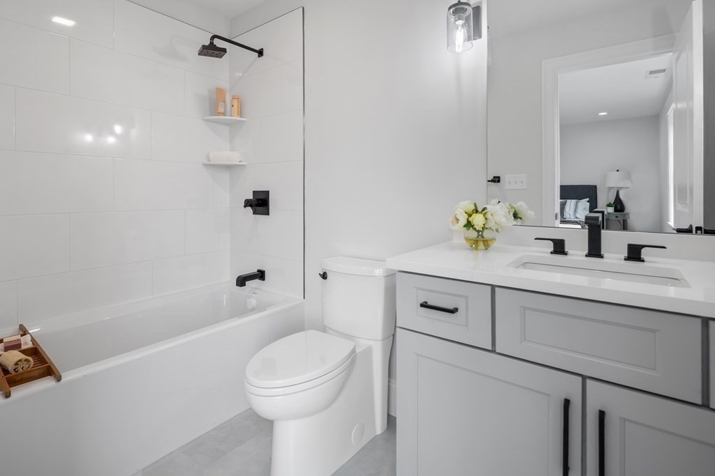 6 Rowell Road Middleton, MA 01949 - Photo 31 of 35 a bathroom with a sink a toilet and shower