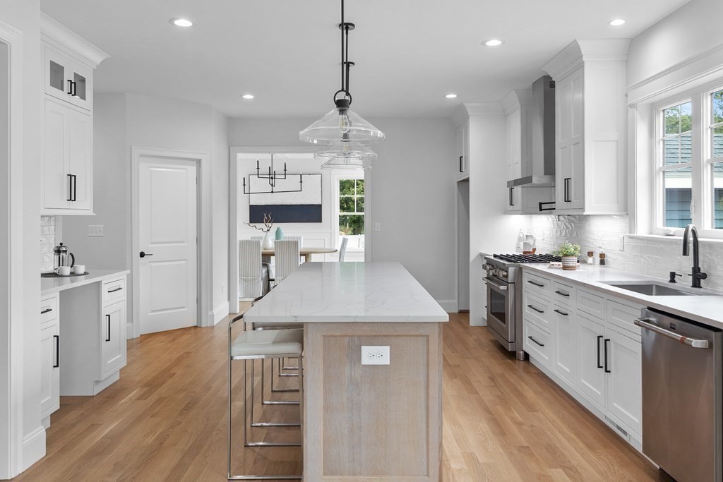 6 Rowell Road Middleton, MA 01949 - Photo 5 of 35 a kitchen with kitchen island a counter top space a sink stainless steel appliances and cabinets