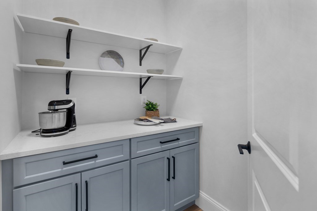6 Rowell Road Middleton, MA 01949 - Photo 8 of 35 a kitchen with a cabinets and a wooden floor