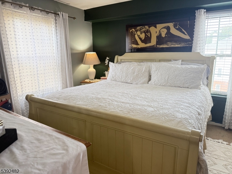 751 Summer Avenue, Unit 3A Newark, NJ 07104 - Photo 11 of 15 a bedroom with a bed and a painting on the wall