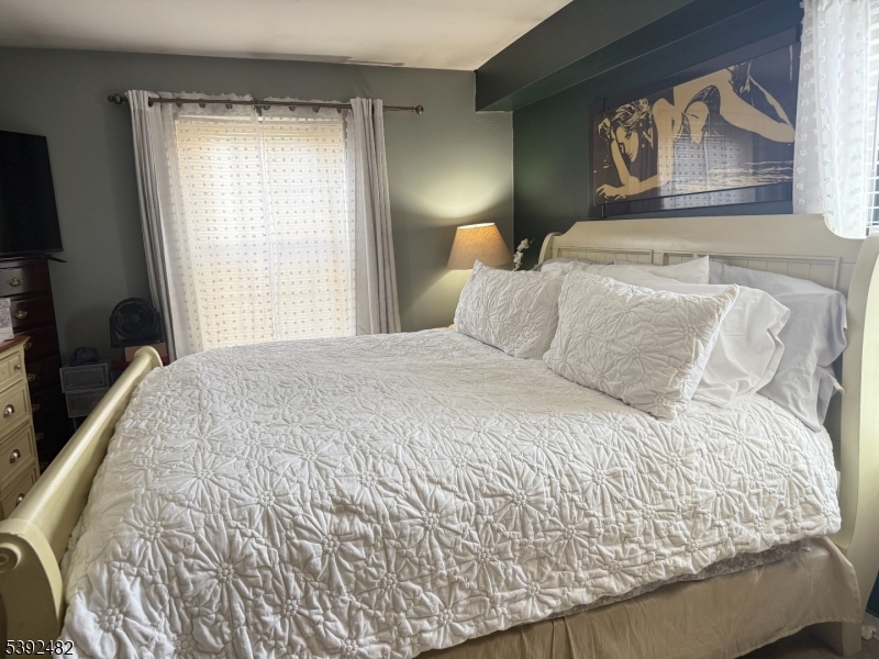 751 Summer Avenue, Unit 3A Newark, NJ 07104 - Photo 12 of 15 a bedroom with a bed and a window