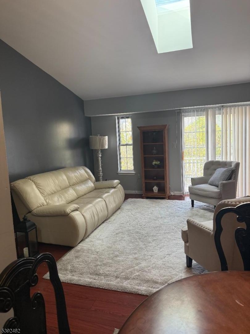 751 Summer Avenue, Unit 3A Newark, NJ 07104 - Photo 3 of 15 a living room with furniture and a flat screen tv