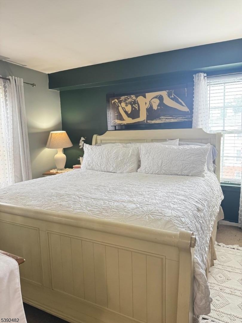 751 Summer Avenue, Unit 3A Newark, NJ 07104 - Photo 10 of 15 a bedroom with a bed and a large window