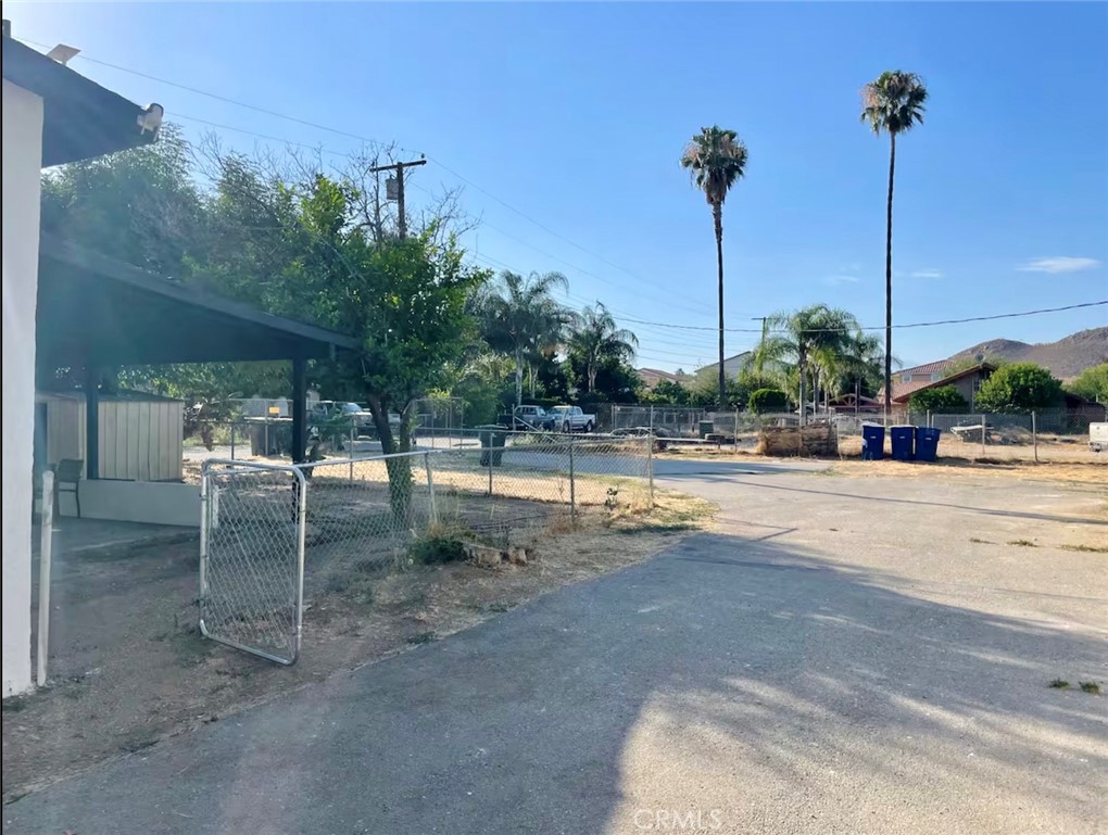 10945-10953 Campbell Avenue Riverside, CA 92505 - Photo 11 of 34 a view of a swimming pool with a table and chairs
