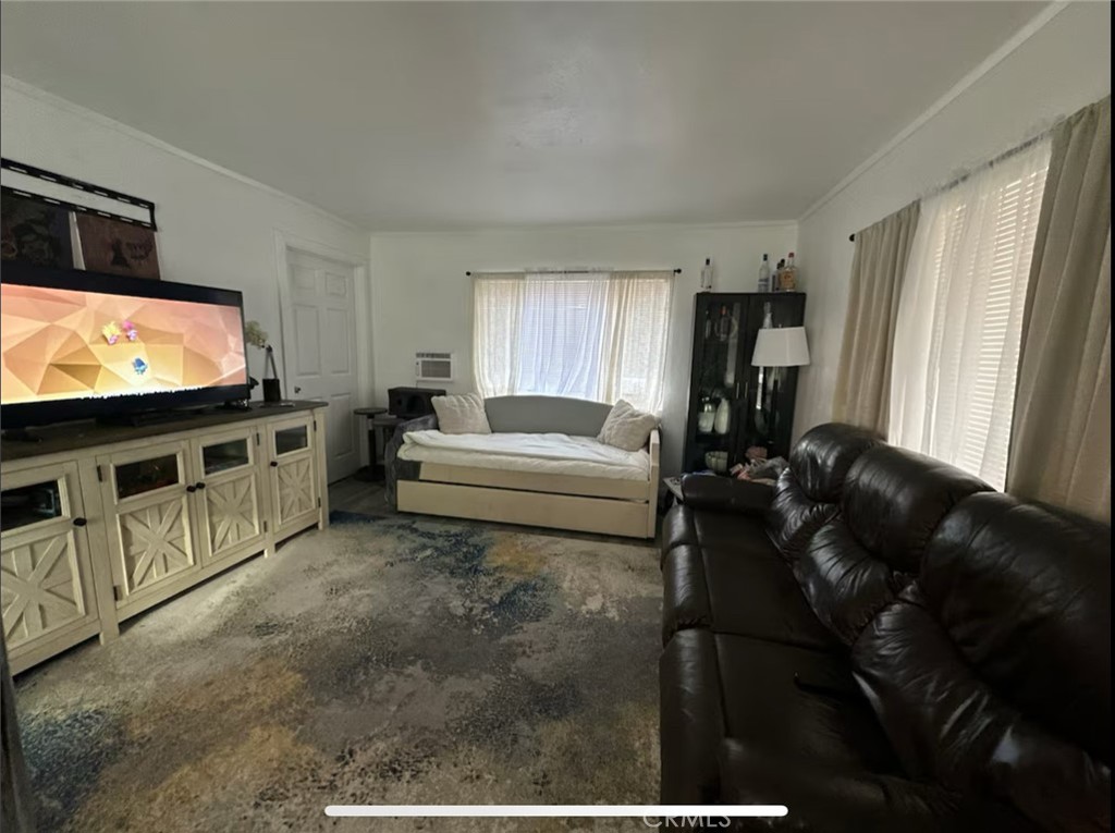 10945-10953 Campbell Avenue Riverside, CA 92505 - Photo 17 of 34 a living room with furniture and a flat screen tv