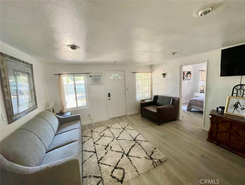 10945-10953 Campbell Avenue Riverside, CA 92505 - Photo 2 of 34 a living room with furniture and a flat screen tv