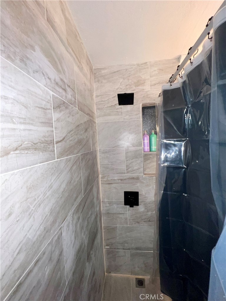 10945-10953 Campbell Avenue Riverside, CA 92505 - Photo 31 of 34 a bathroom with a shower